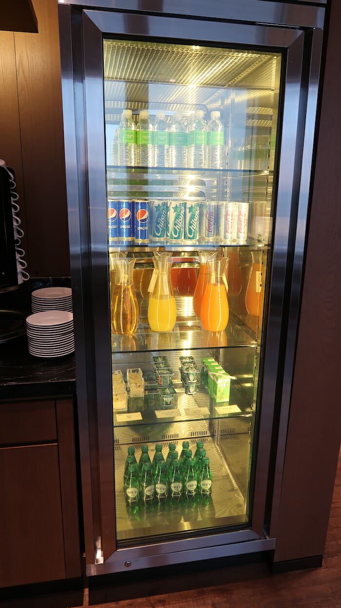 a refrigerator with drinks and beverages