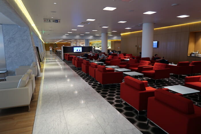 a room with red chairs and tables