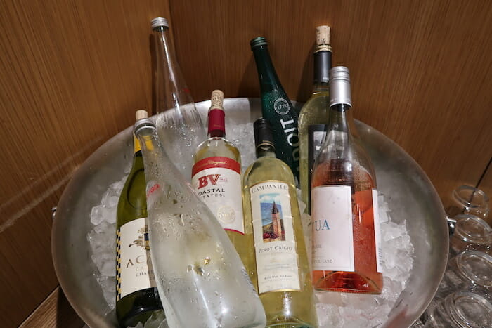 a bucket of wine bottles