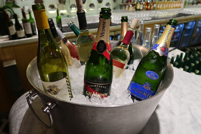 a bucket of wine bottles