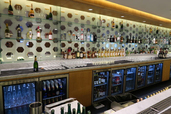 a bar with bottles and glasses