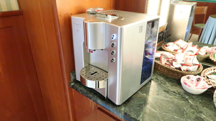 a silver coffee machine on a counter