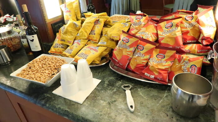 a group of bags of chips and nuts on a counter