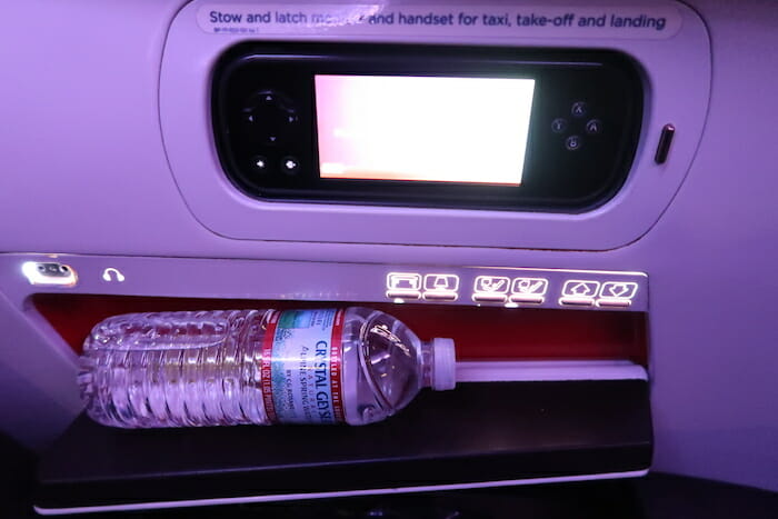 a bottle of water on a shelf