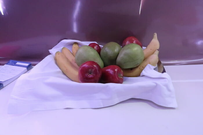 a group of fruits on a white cloth