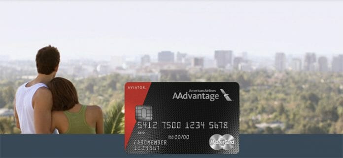a woman standing next to a credit card