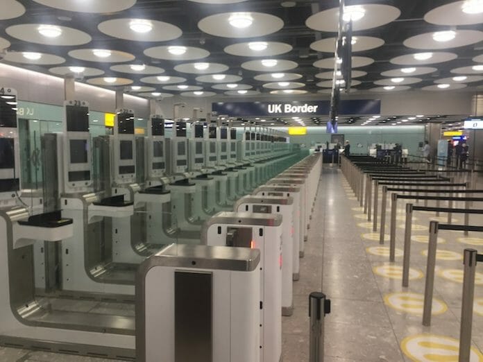 a row of electronic machines in a airport