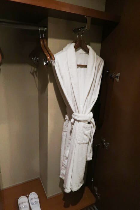 a white robe on swingers