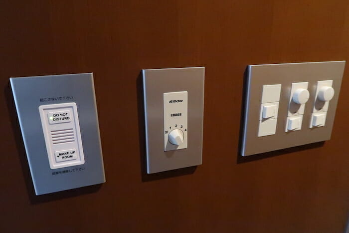 a group of switches on a wall