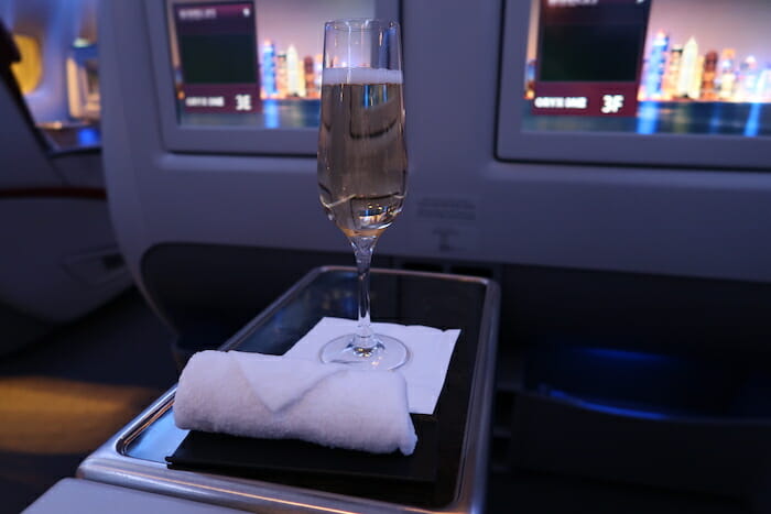 a glass of champagne on a tray