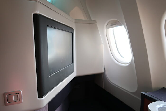 a tv on the wall of an airplane