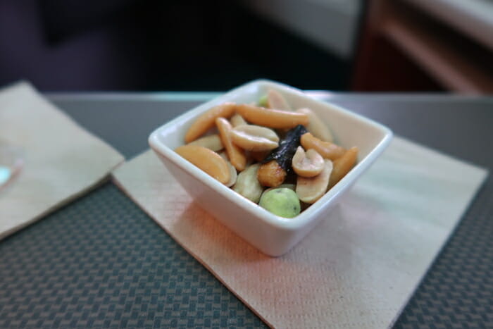 a bowl of nuts on a napkin