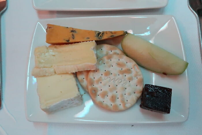 a plate of cheese and fruit