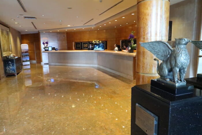 a lobby with a statue of a swan