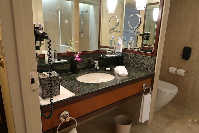 a bathroom with a sink and mirror