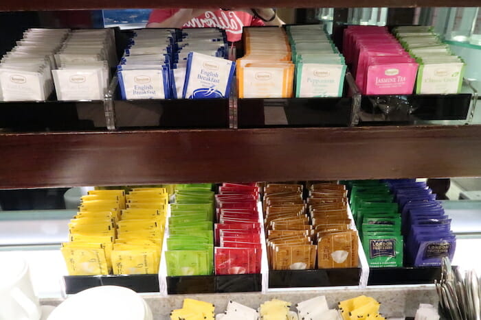 a shelf with packets of tea