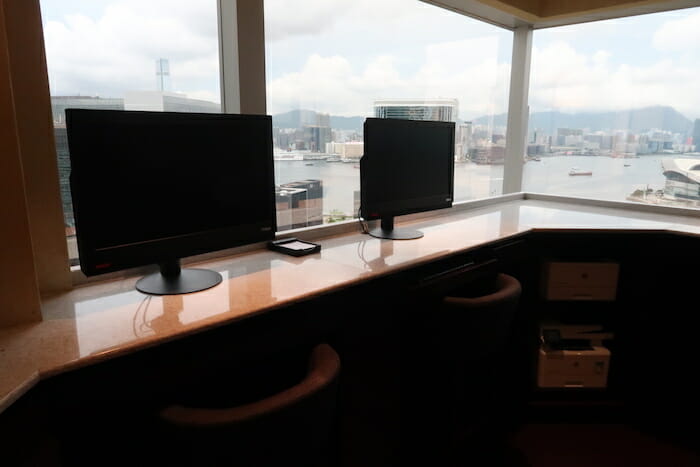 a two computer monitors on a counter