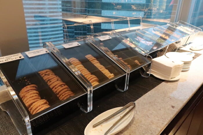 a row of cookies in clear containers