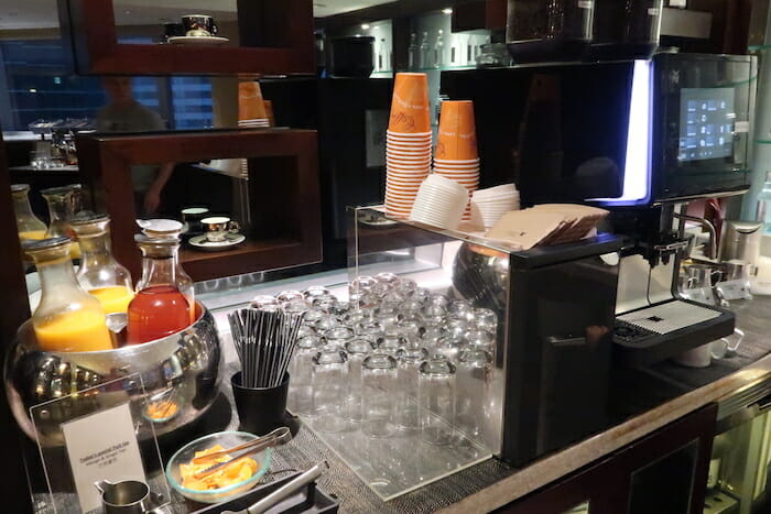 a group of glasses and cups on a counter