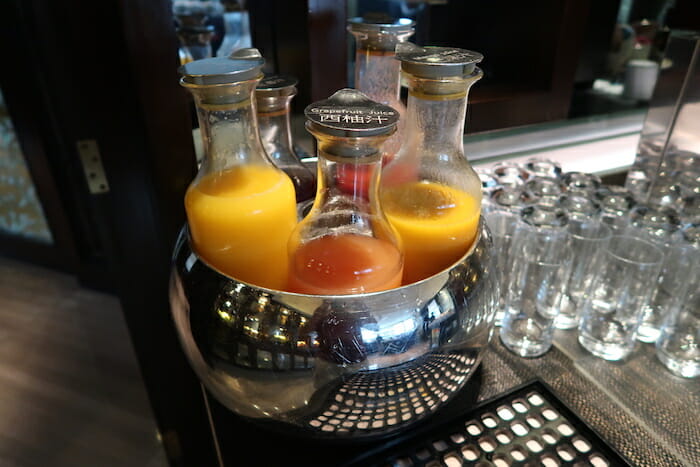 a group of bottles of liquid in a bowl