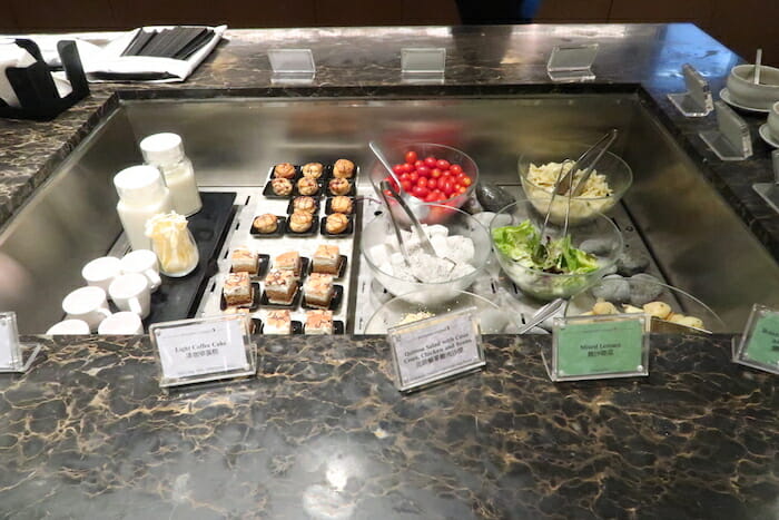 a buffet with different food items on it