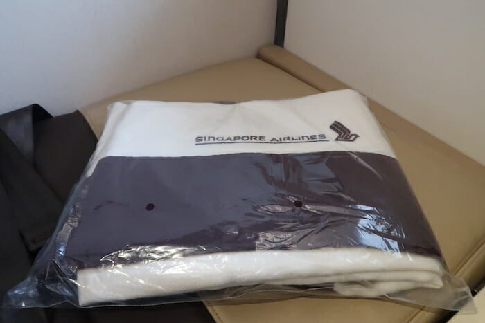 a white and black folded clothes in a plastic bag