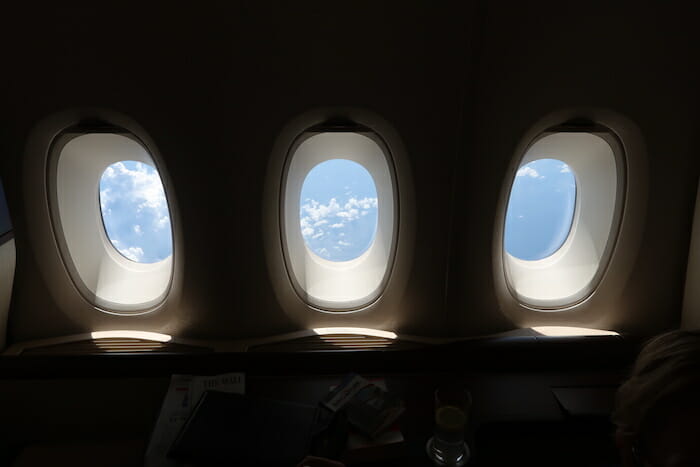 a window with blue sky and clouds