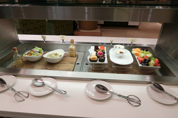 a buffet with different food items on it