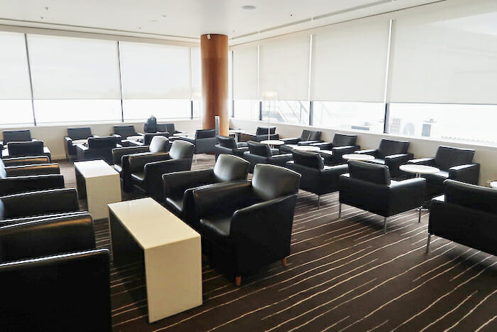 a room with black chairs and tables