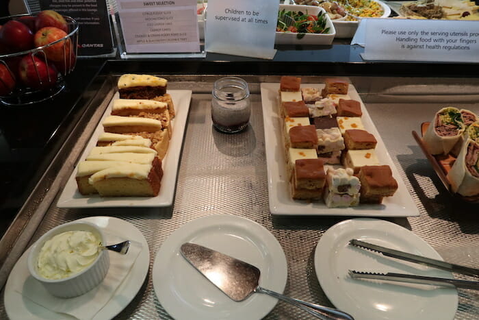 a table with plates of desserts