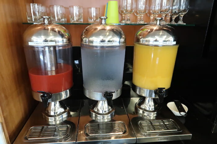 a group of juice dispensers