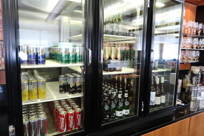 a display case with bottles and cans of beer