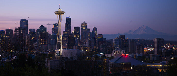 a city skyline with a tall tower