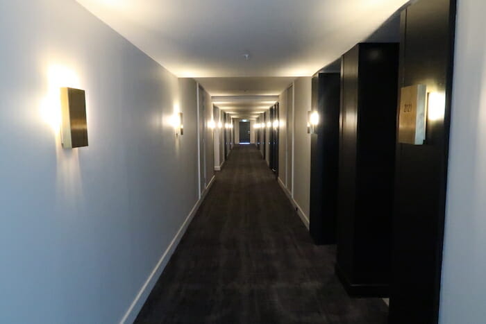 a long hallway with lights on