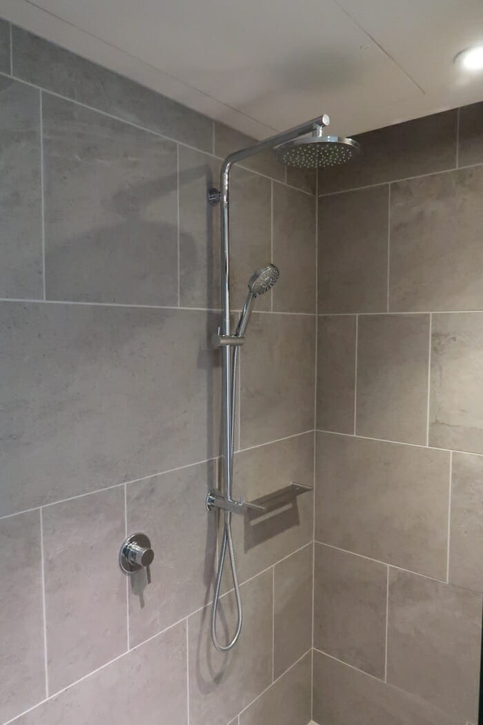 a shower head in a bathroom