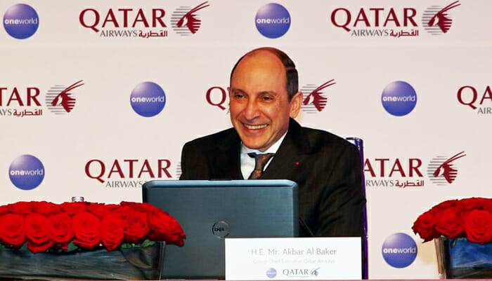 a man sitting at a desk with a laptop