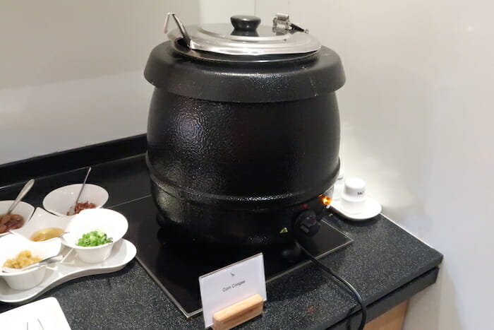 a large black pot with a lid on a black surface