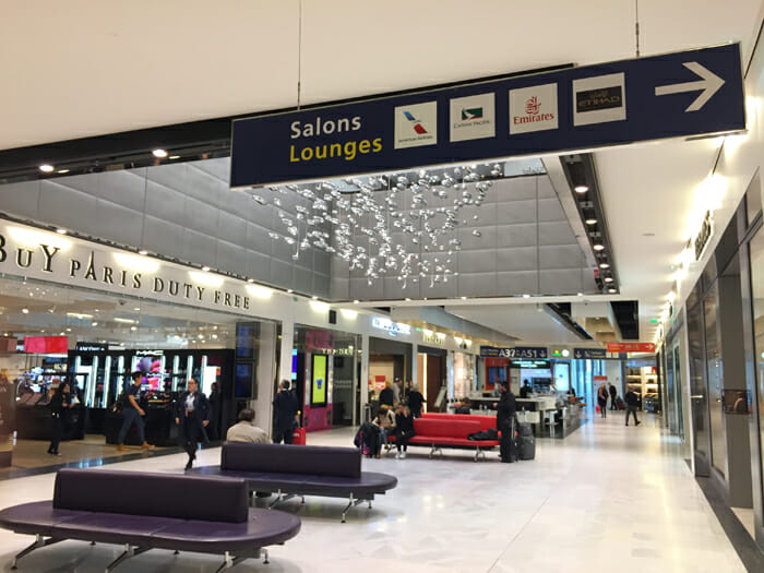 a large airport with people walking and walking