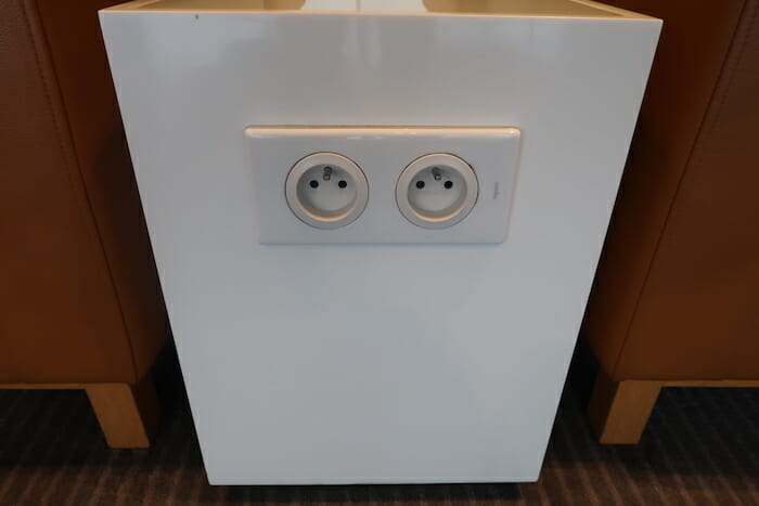 a white rectangular object with two outlets