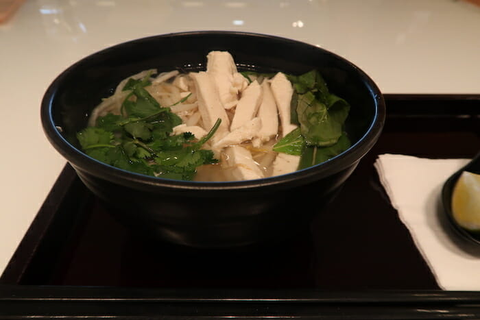 a bowl of soup with vegetables and meat