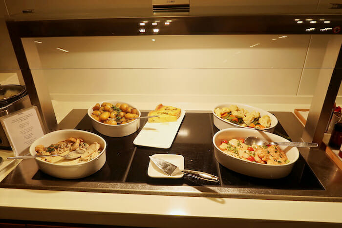 a group of bowls of food on a stove