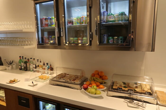 a display case with drinks and beverages