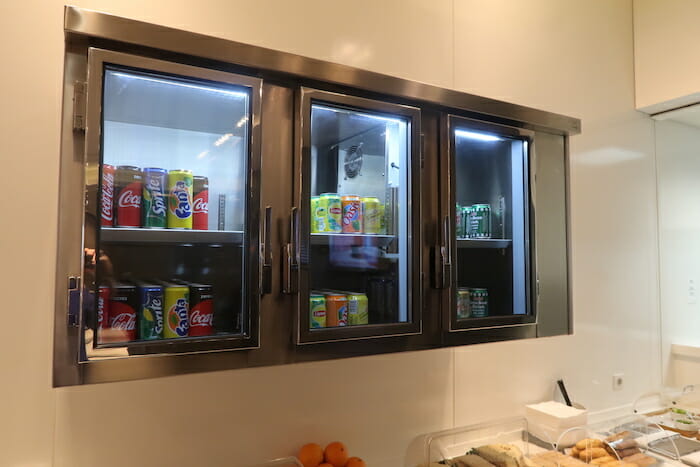 a display case with canned beverages