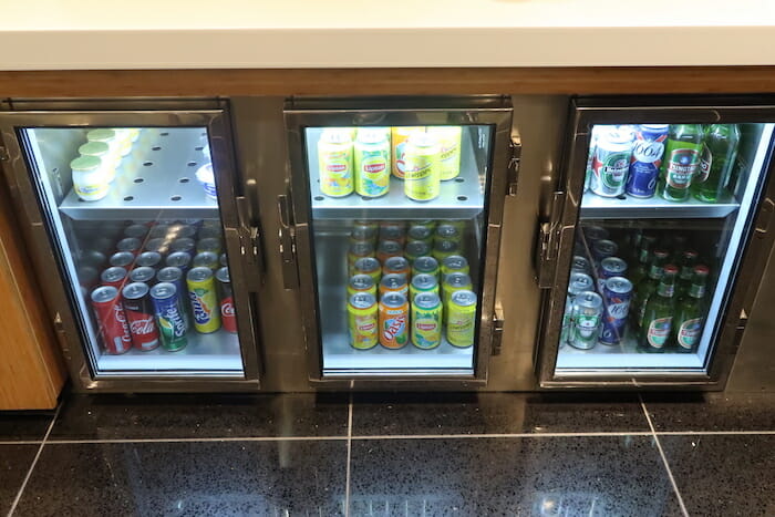 a group of cans in a refrigerator