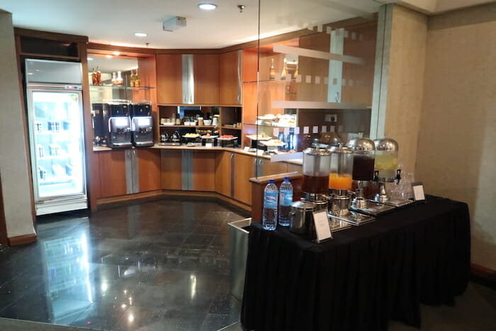 a buffet table with drinks and beverages on it