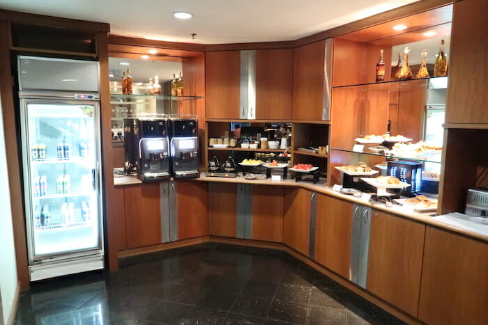 a kitchen with food on shelves