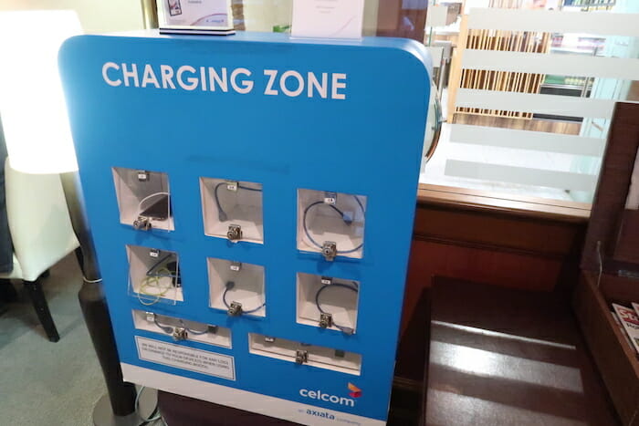 a blue charging station with wires