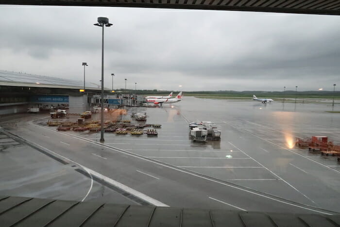 an airport with airplanes on the runway