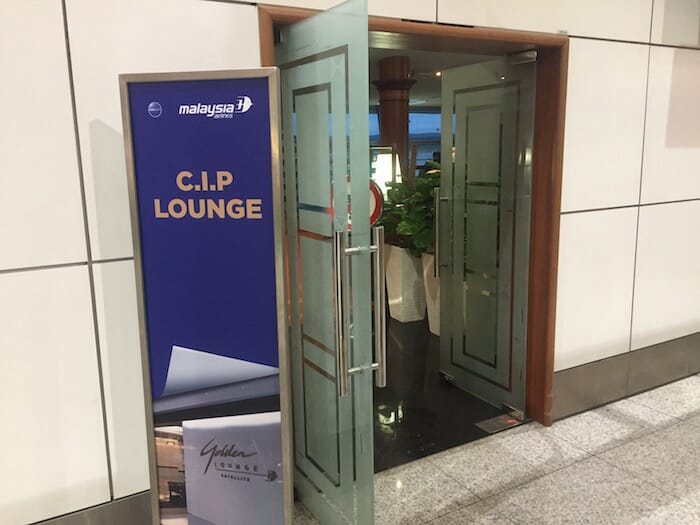 a glass door with a sign in front of it