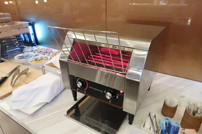 a toaster oven with a red light